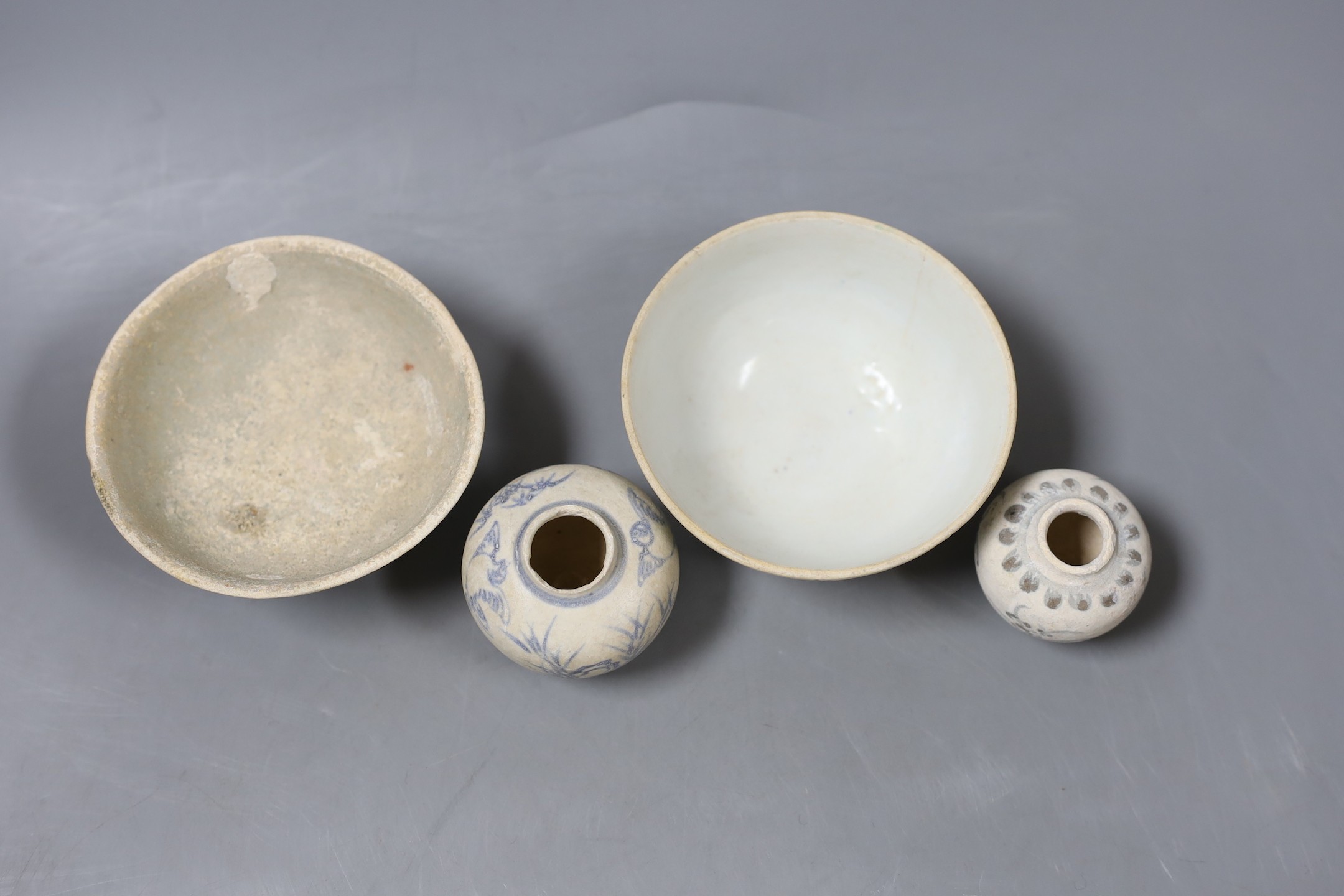 A group of shipwreck ceramics, to include two Ming jarlets, a Qingbai bowl and a Chinese polychrome bowl (4)